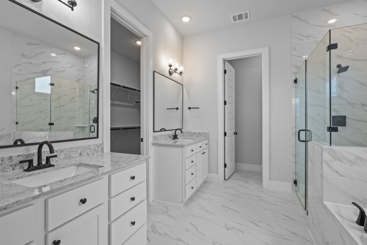 A bathroom with a glass shower.
