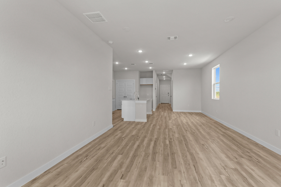 A long hallway with white walls.