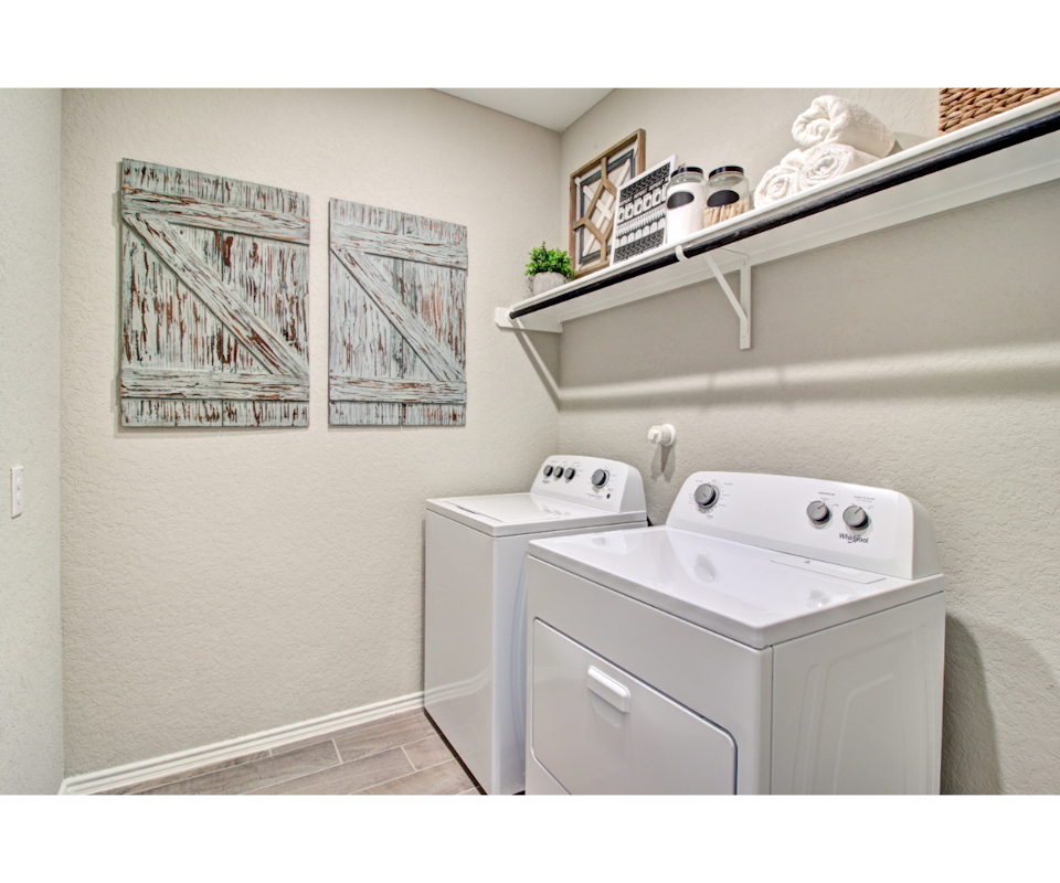 A white washer and dryer in a room.