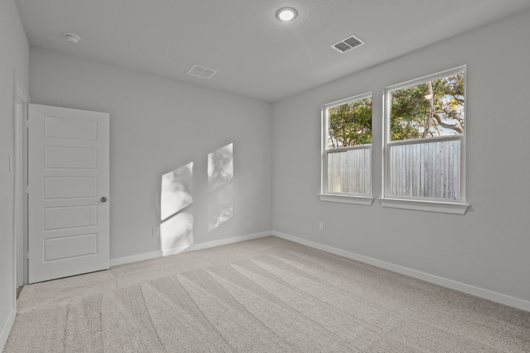 A room with a white door and a white door.
