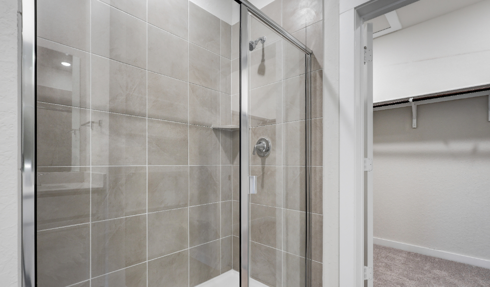 A shower with a glass door.