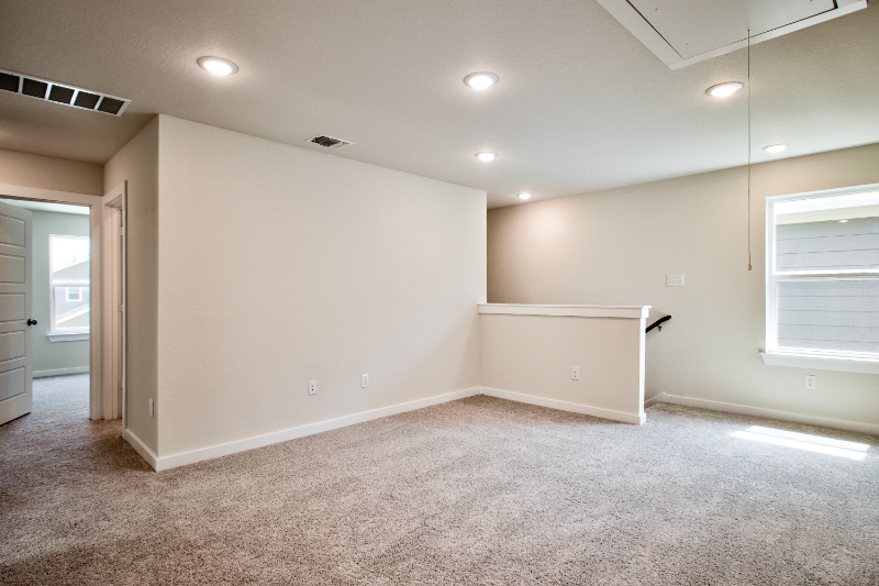 A room with a white wall and a white floor.