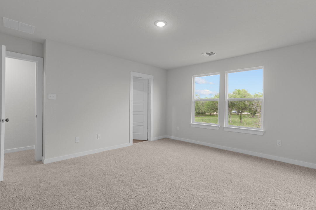 A room with a window and a door.