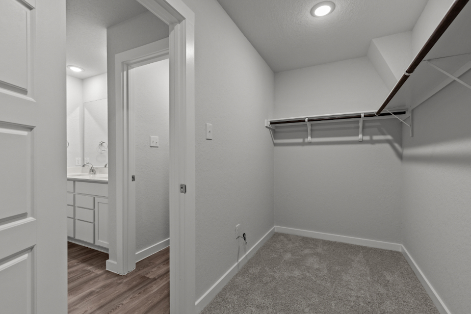 A bathroom with white walls.