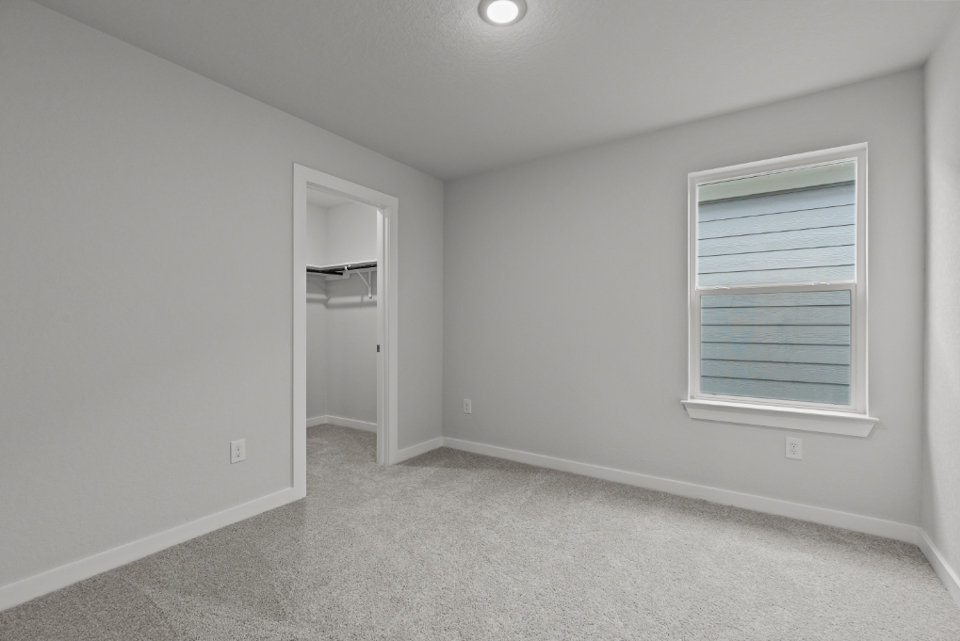 A room with a door and a window.