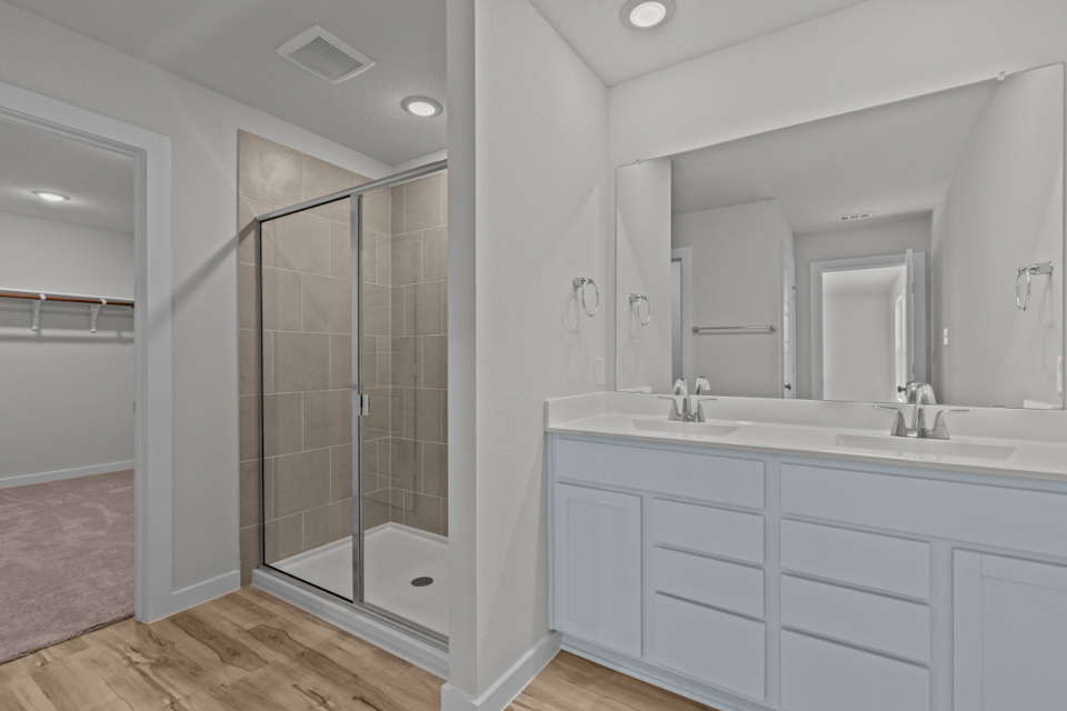 A bathroom with a glass shower.