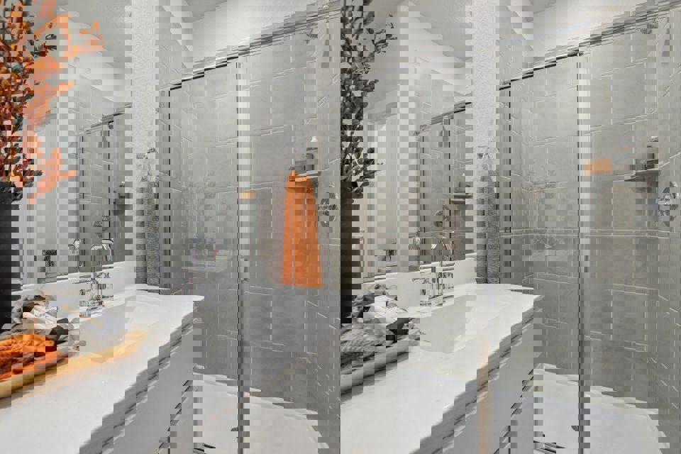 A bathroom with a glass shower.