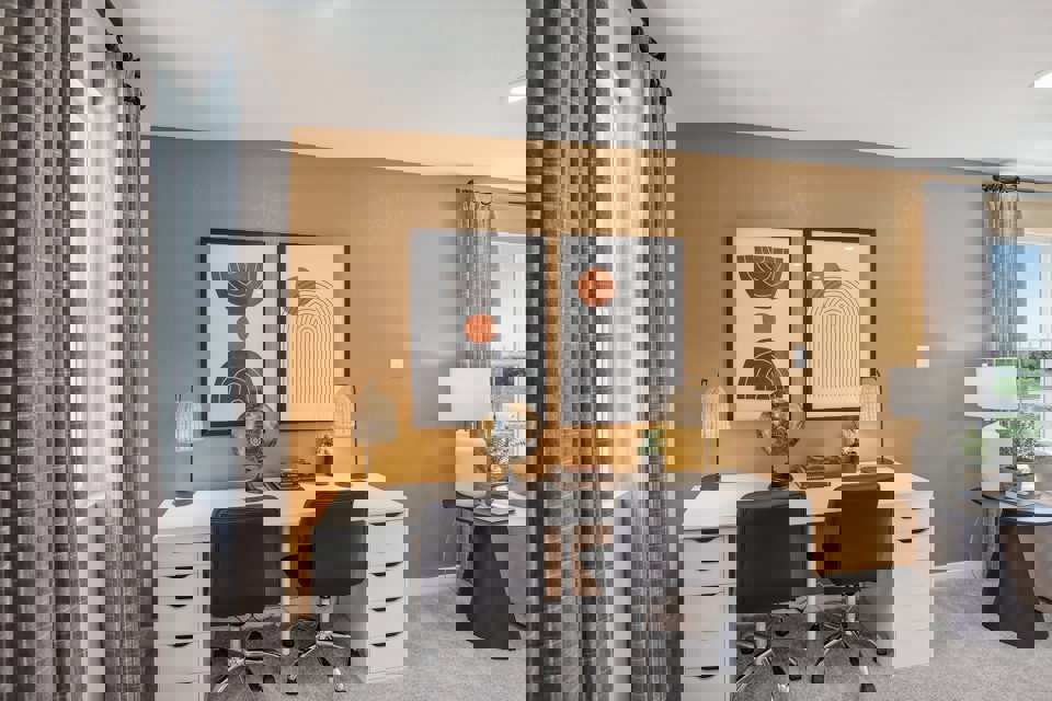 A room with a desk and a chair.