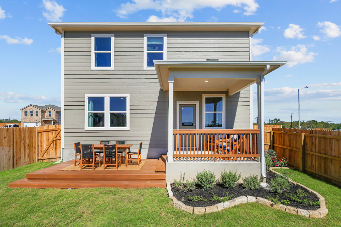 A small house with a deck.