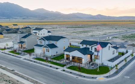 A row of houses on a road.