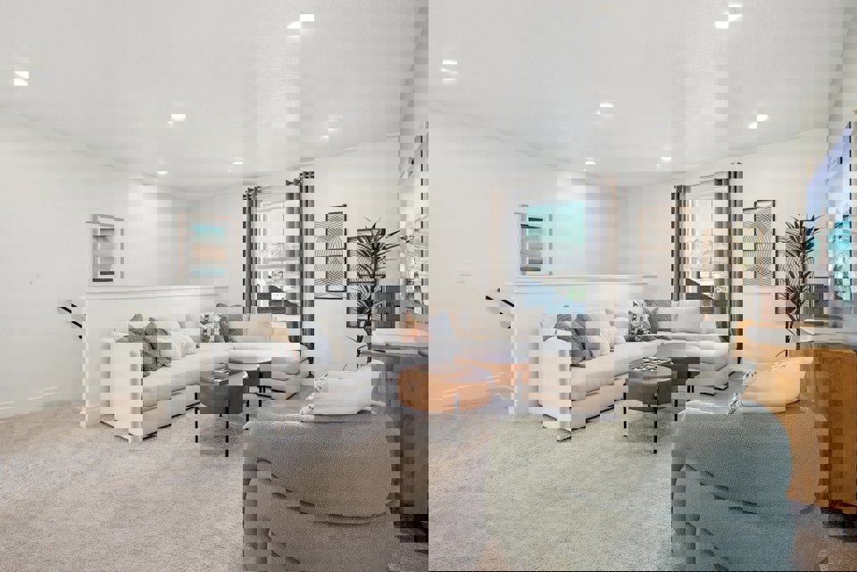 A living room with a couch and a table.