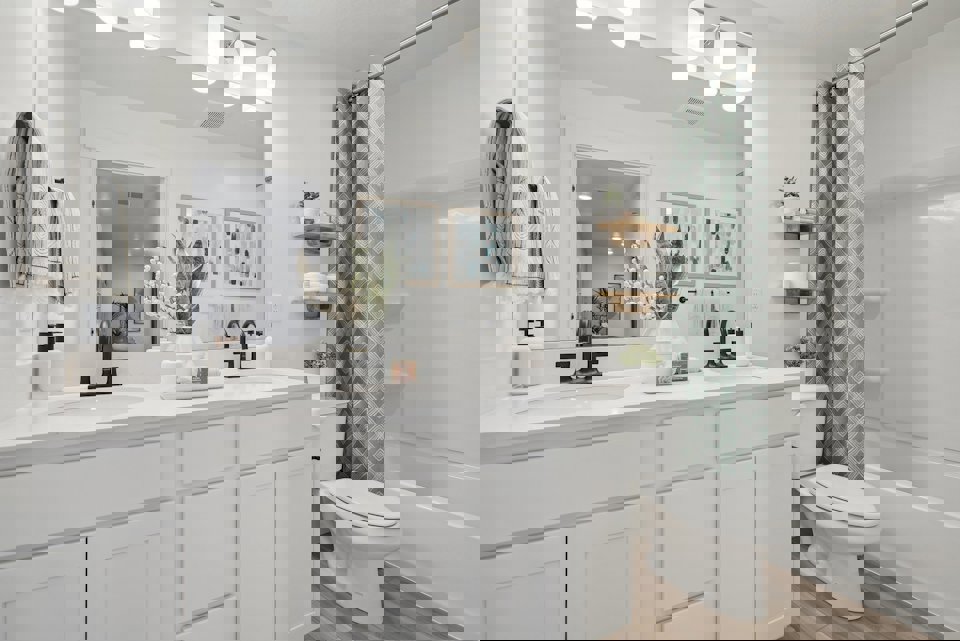 A bathroom with a tub toilet and sink.