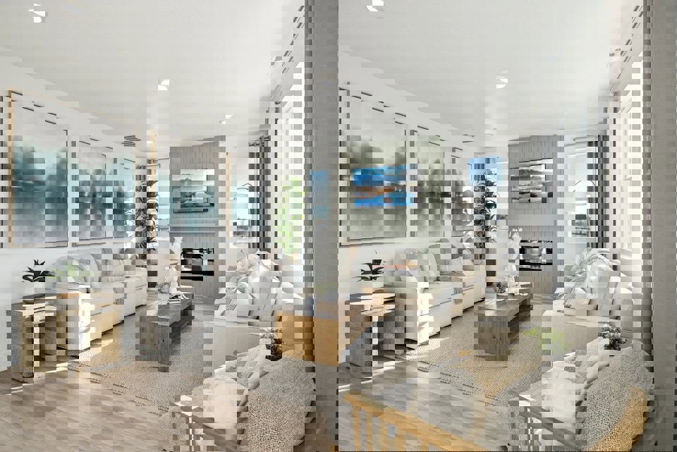 A living room with a large television.