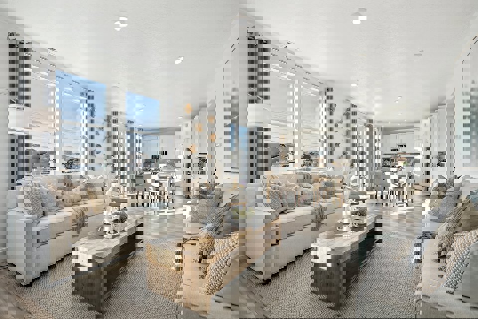 A large living room with a large window.