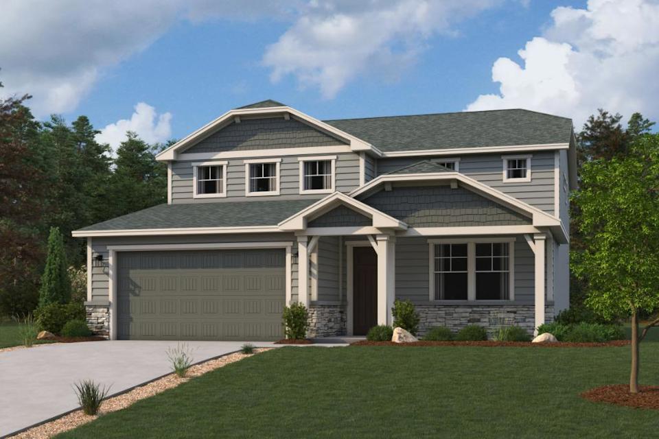 A house with a lawn and trees.