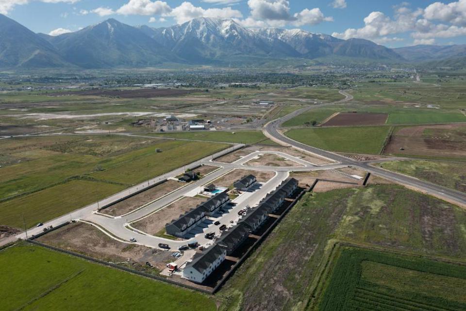 A large building with a parking lot.