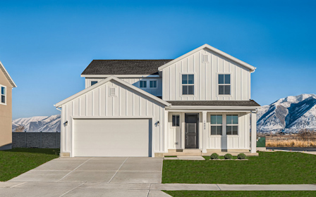 A white house with a mountain in the background.