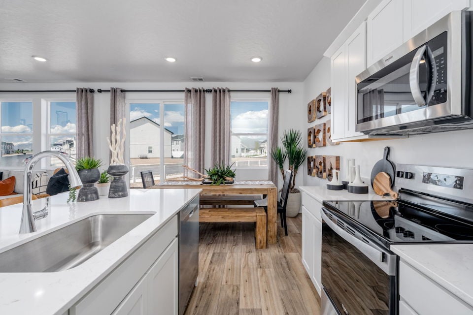 A kitchen with a large window.