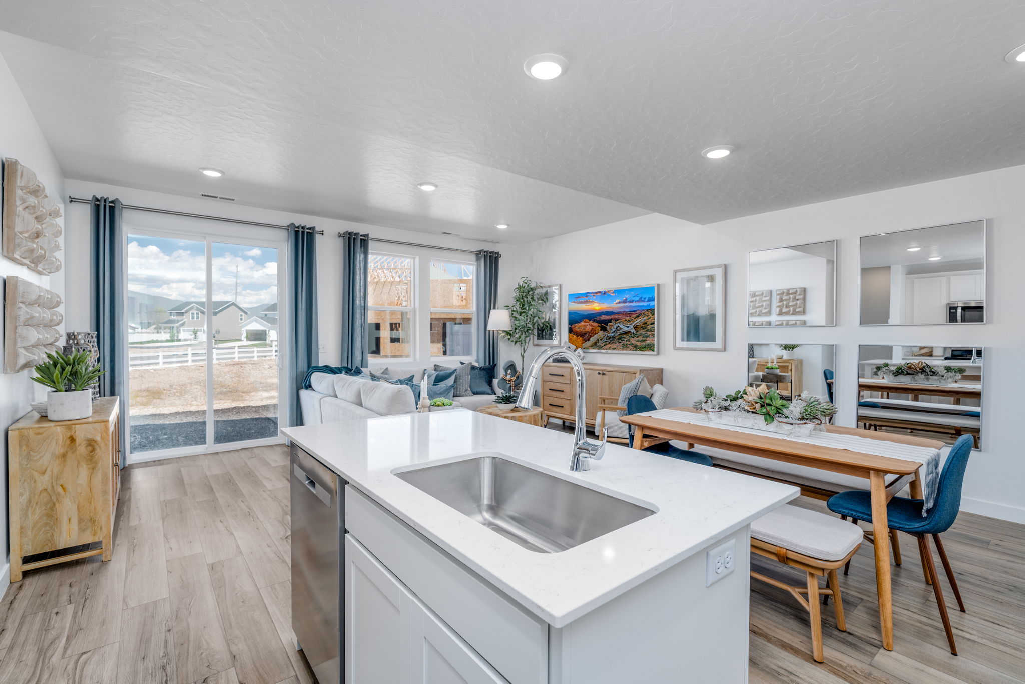 A kitchen with a sink and a table.