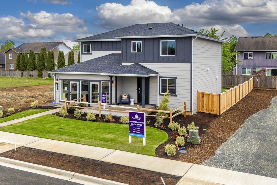 A house with a sign in front.