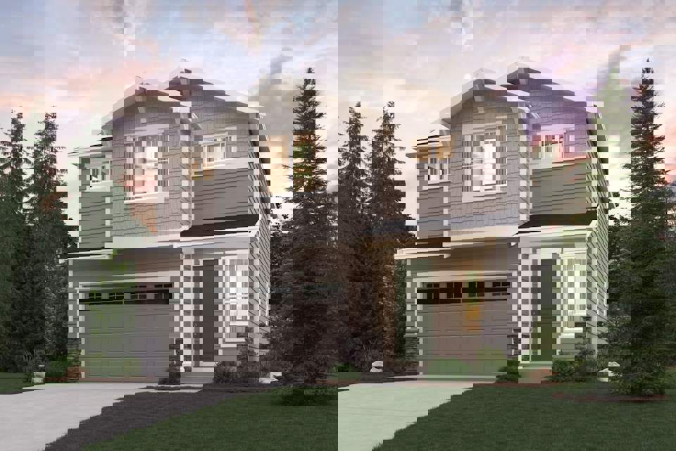 A house with a garage and trees.