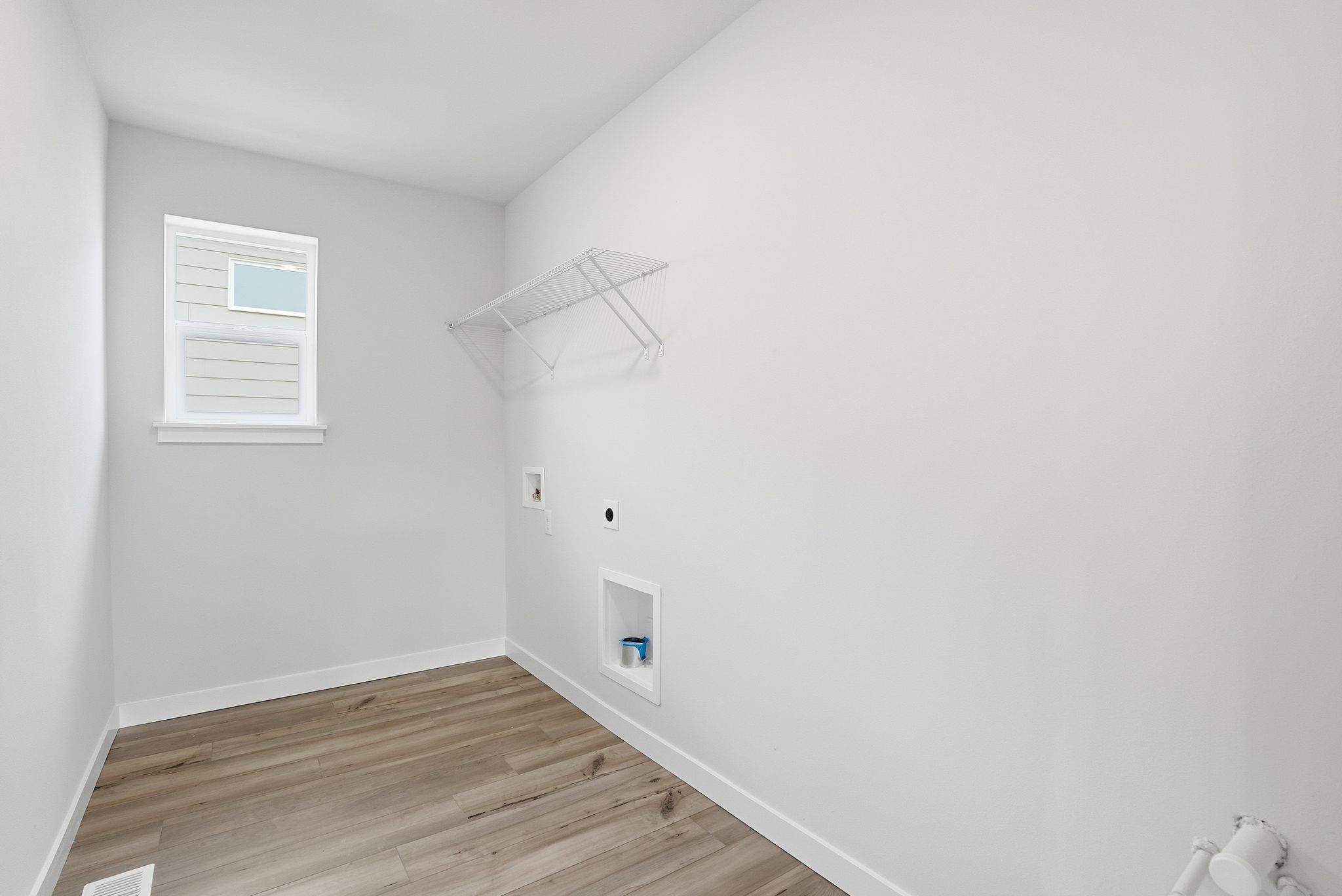 A room with a wood floor and a wood floor.