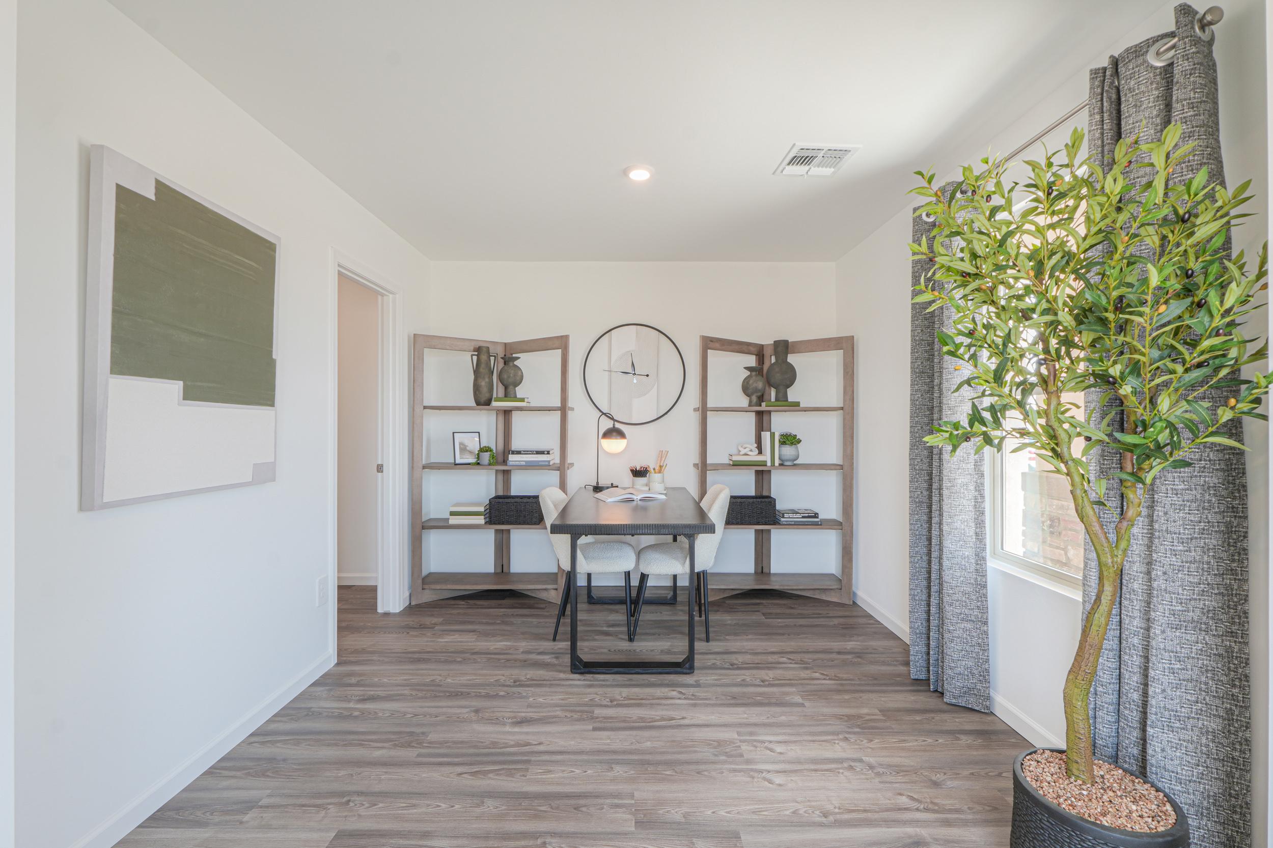 A room with a table and shelves.