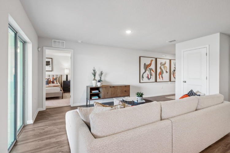 A living room with a couch and a table.