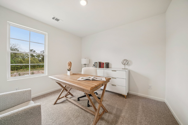 A room with a table and chairs.