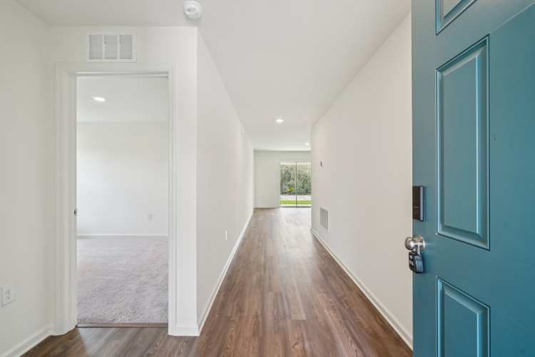 A hallway with blue doors.