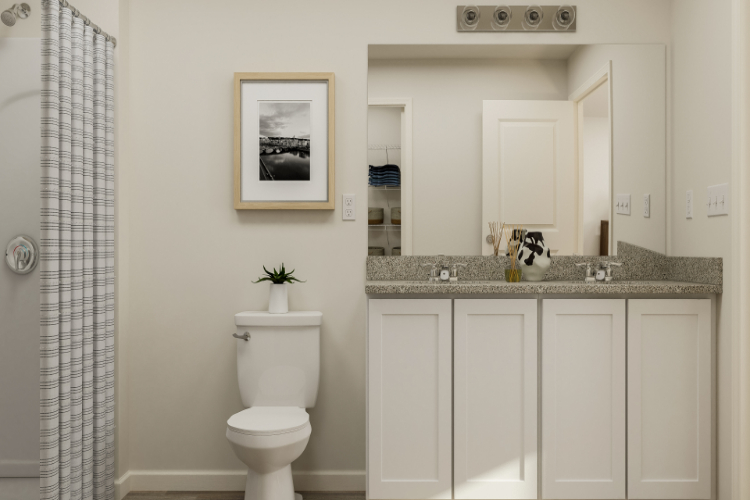 A bathroom with a toilet and sink.