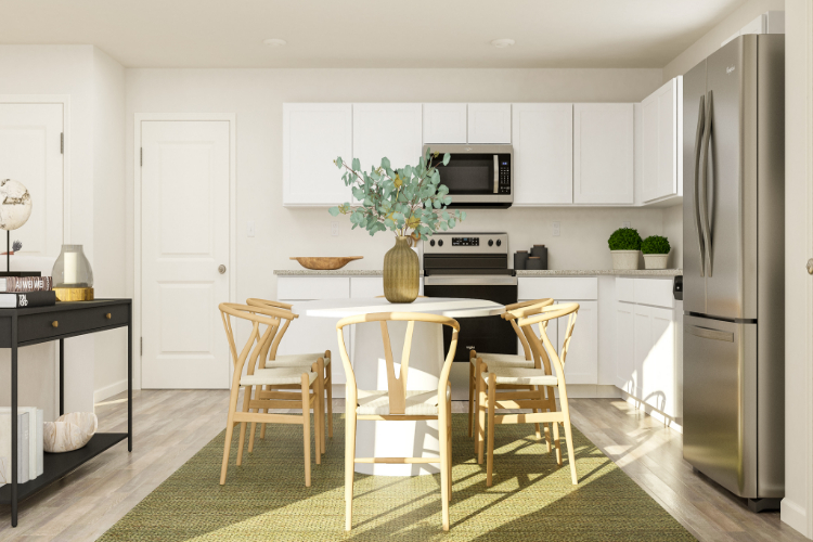 A kitchen with a table and chairs.