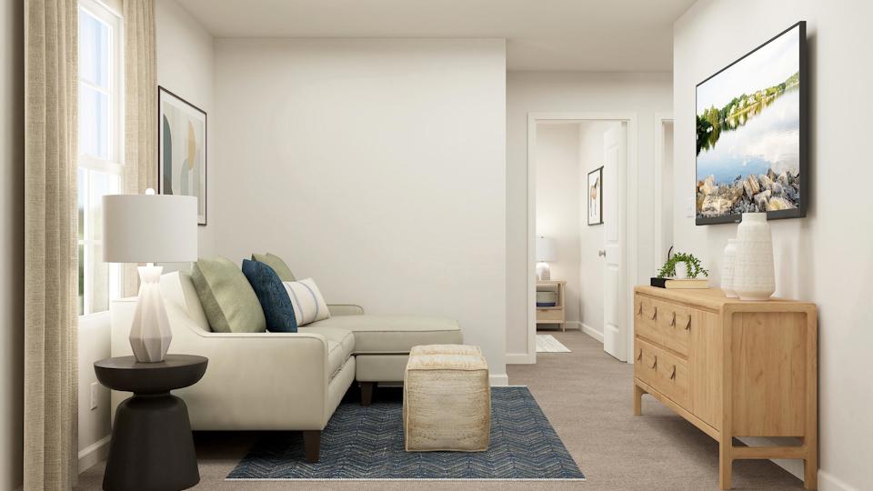 A room with a couch and a table.