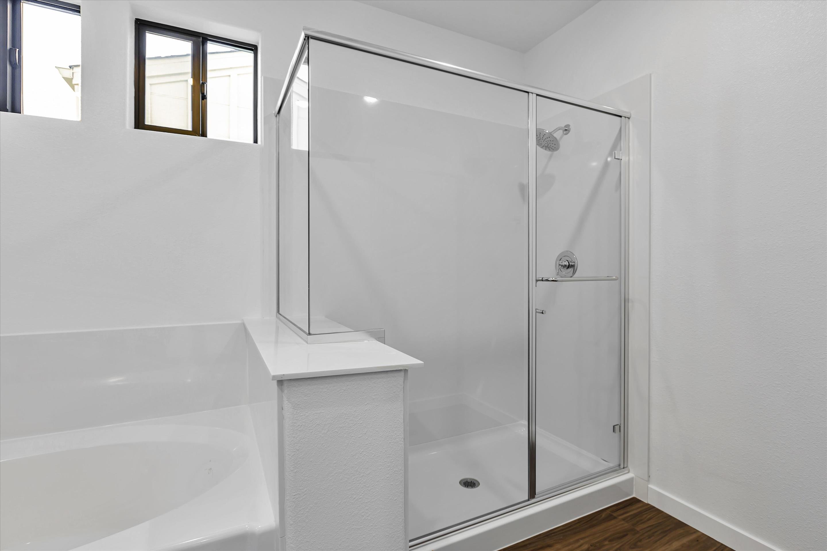 A bathroom with a glass shower.