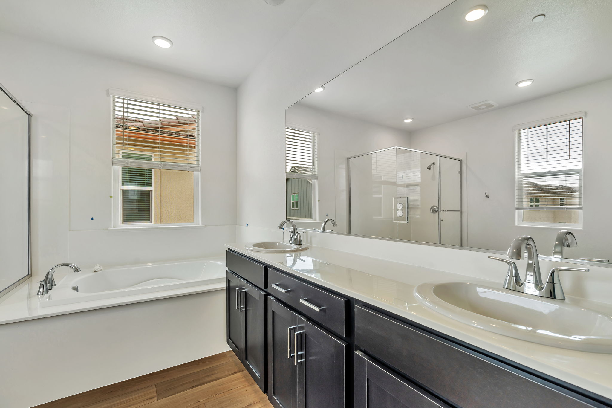 A bathroom with a large mirror.
